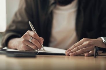 Hands, planning and writing with designer person at desk...