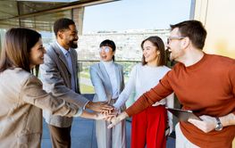 Team members engage in a joyful collaboration during a...