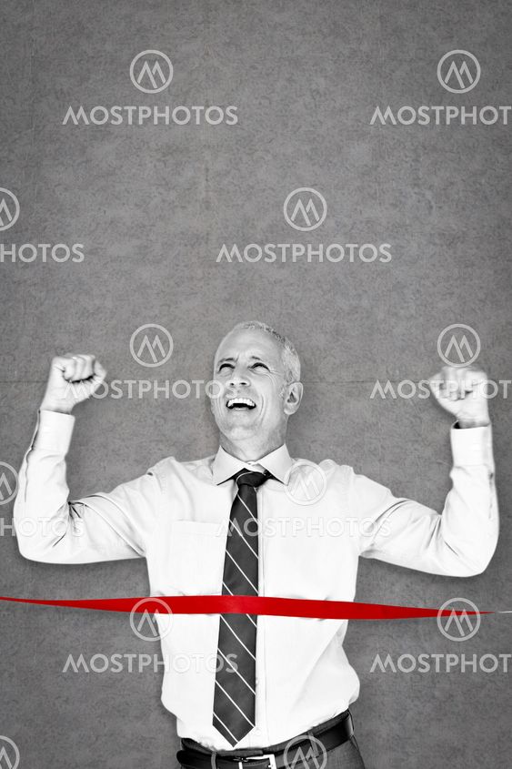 Composite image of businessman winning race