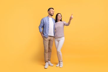 Couple expressing love and joy together against a...