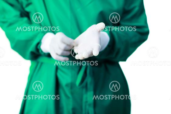 Surgeon putting on his gloves