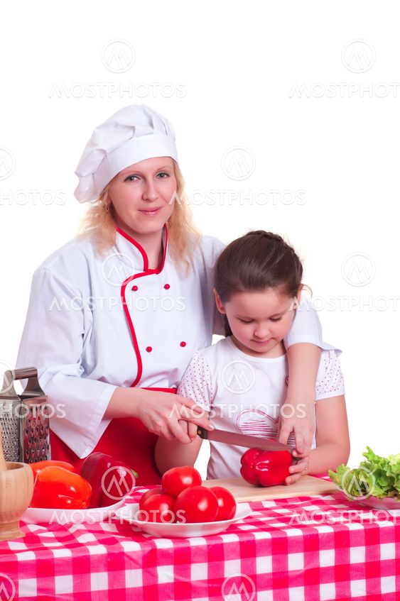 Mother and daughter cooking dinner