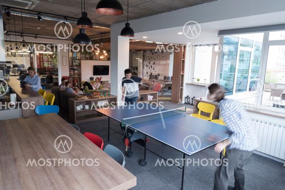 playing ping pong tennis at creative office space