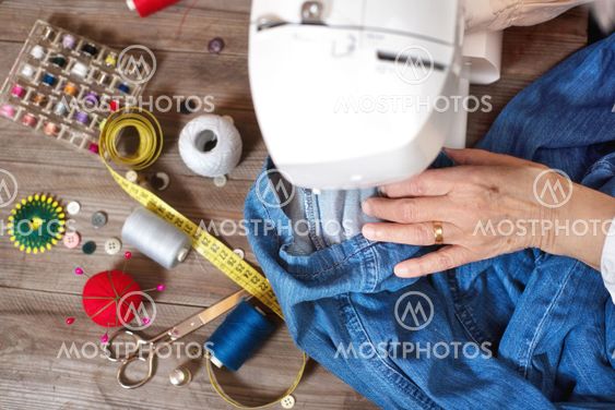 Close-up top view, of senior woman hands seamstress...