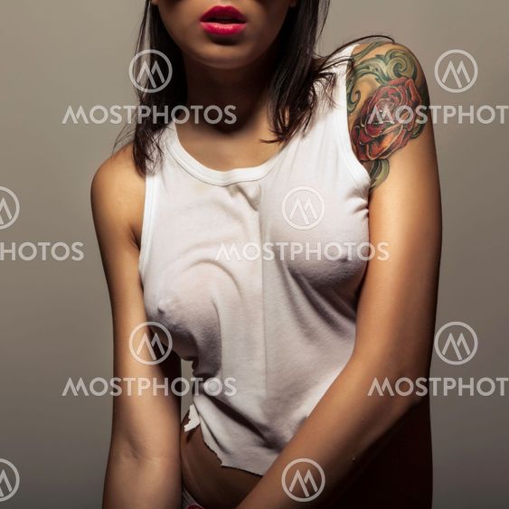 tattoo girl in wet t-shirt