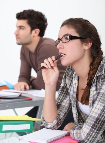 Two students concentrating in class