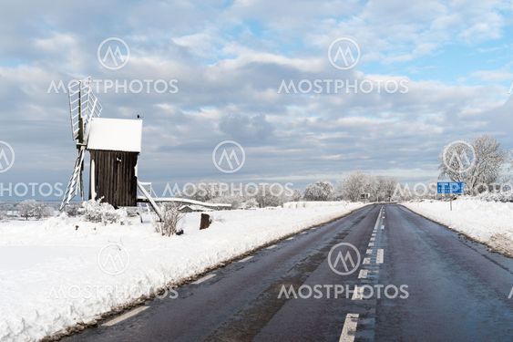 Old windmill by roadside