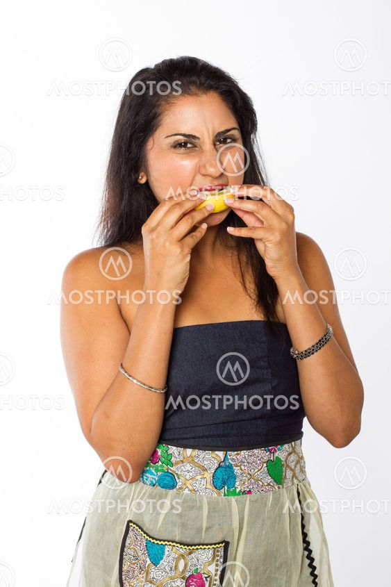Indian Woman Eats Lemon