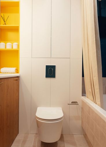 A stylish bathroom with a focus on a pristine white...