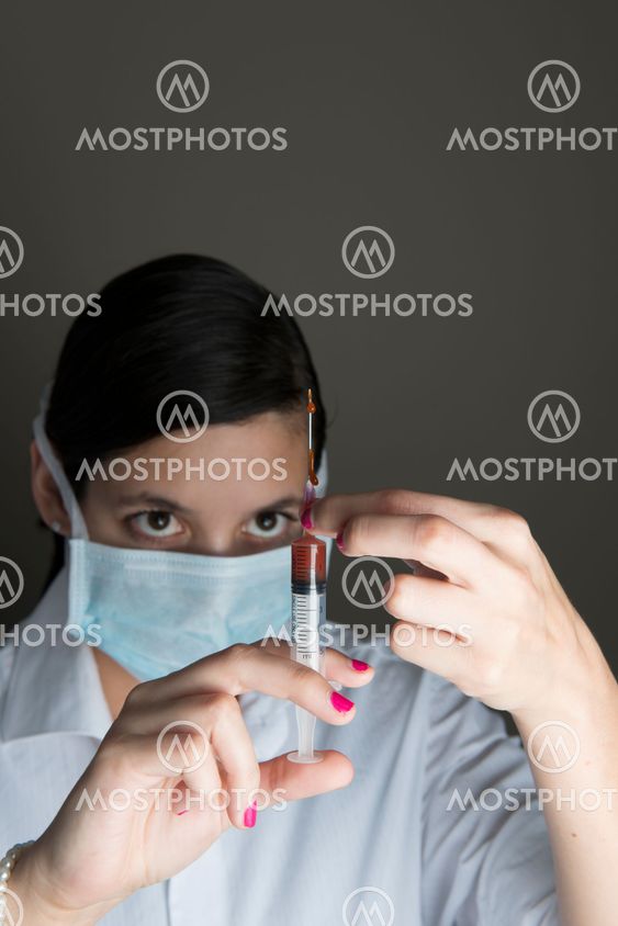 Beautiful women holding syringe