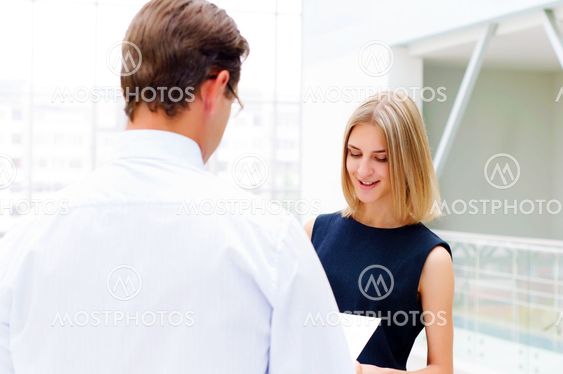 business man and business woman in the office to discuss reports