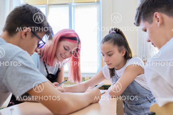 School, education, adolescence. Group of teenage...