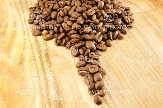 Coffee beans on vintage wooden board