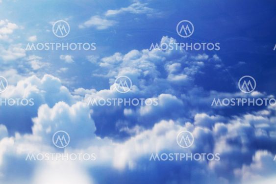 dramatic blue sky with clouds and sun rays