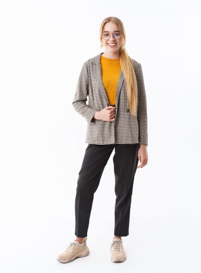 Full length of a smiling young blonde girl