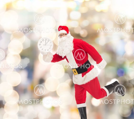 man in costume of santa claus with clock