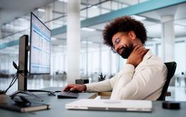 African American businessman stretches muscles
