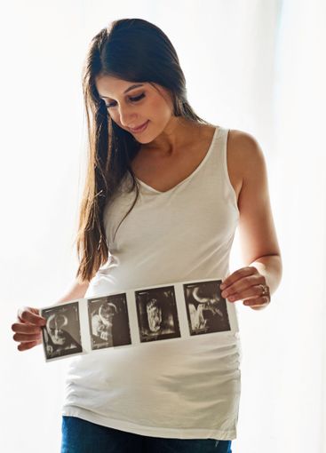 Pregnant, woman and scan of baby in home with sonogram,...