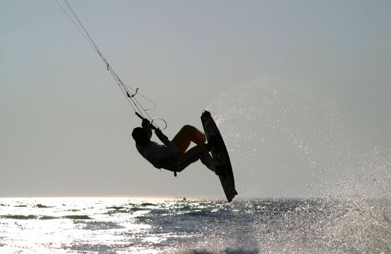 kiteboarder taking off for a jump