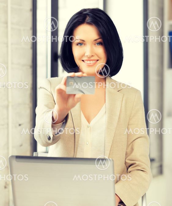happy woman with laptop computer and credit card