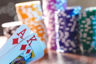 Poker game set of cards and chips close up