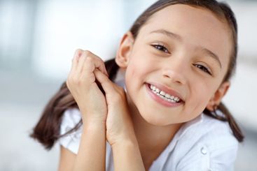 Playful, confident and portrait of girl in home for joy,...
