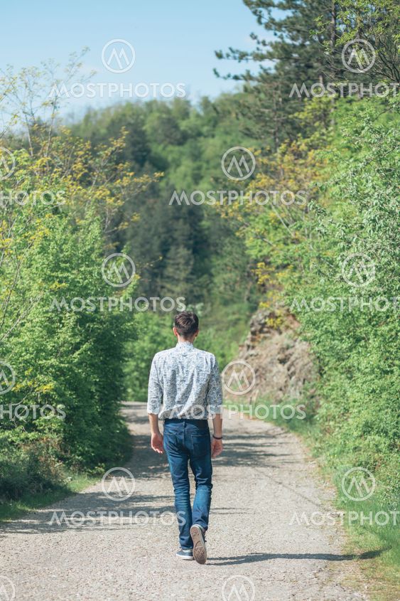 Beautiful young man enjoying in nature on the spring...