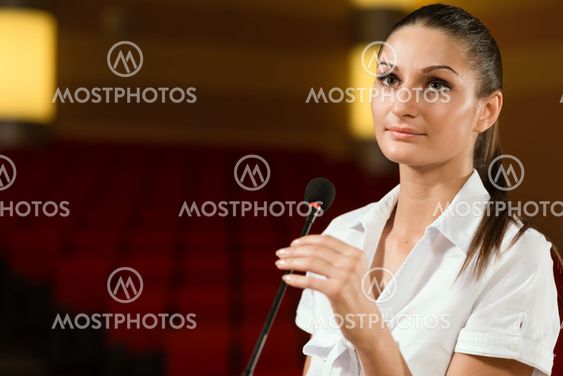 Portrait of a business woman with microphone