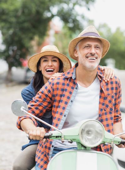 Happy couple on moped