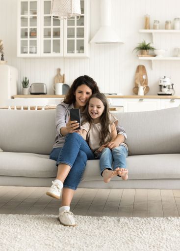 Happy family millennial mother little daughter playing...