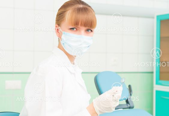 female dentists in protective mask