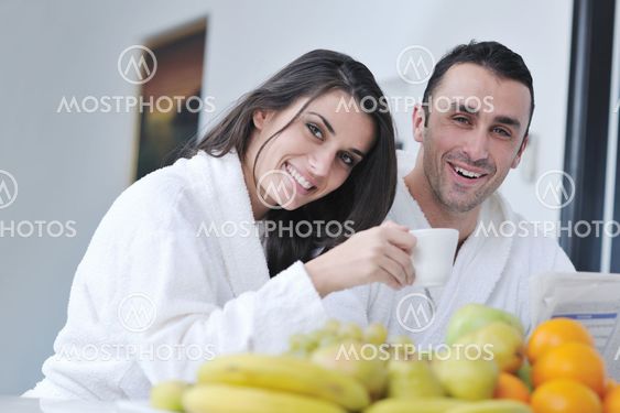 young couple have fun in modern kitchen