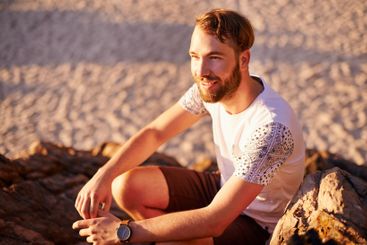 Relax, smile and travel with man at beach for summer...