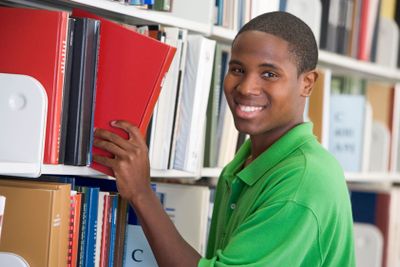 University student choosing book in library