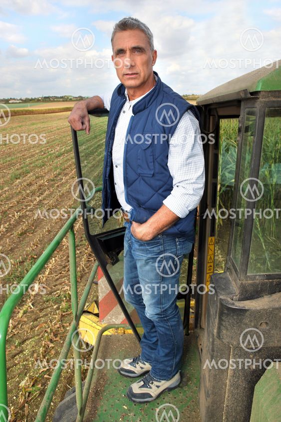 Farmer and tractor in a field