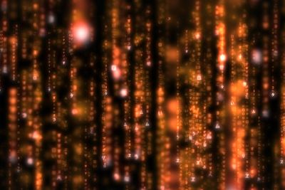 Lines of orange blurred letters falling