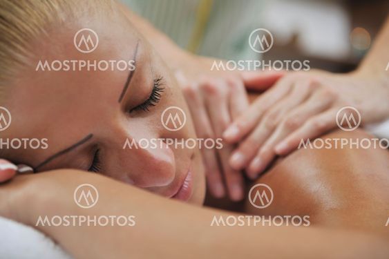 woman back massage treatment