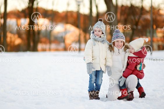 Young mother and her daughters on a winter day