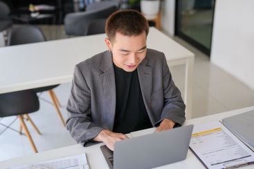 Business man working using laptop computer Hands typing...