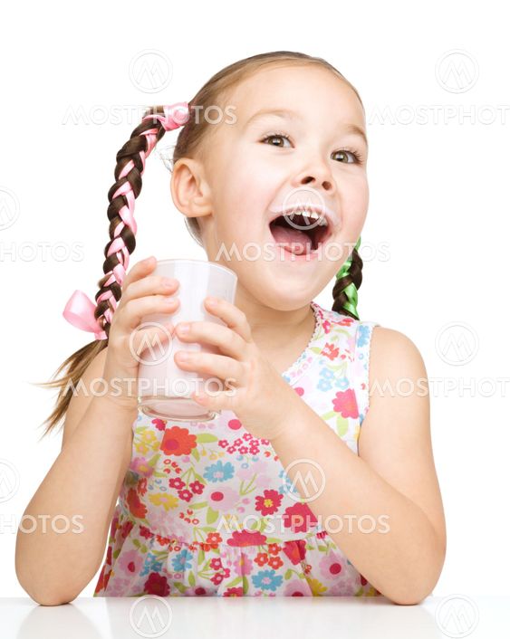 Cute little girl with a glass of milk
