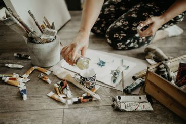 Paint, water and paper, creative person in studio and...