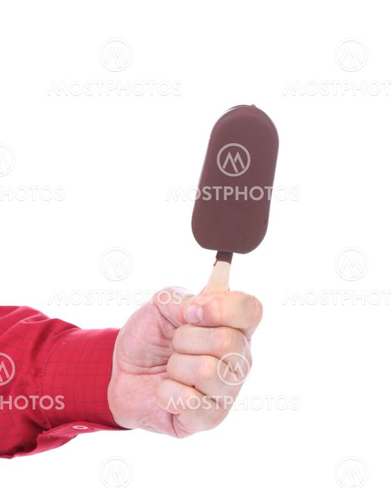 Hand holds chocolate vanilla ice cream.