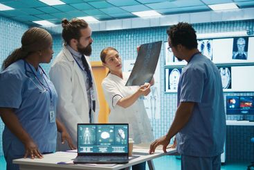 Medic discuss human anatomy scans in a radiology...