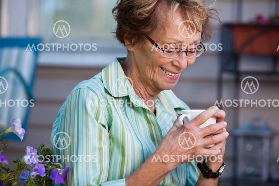Senior Woman with Warm Drink Outdoors