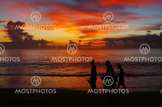 Walking on the beach at sunset