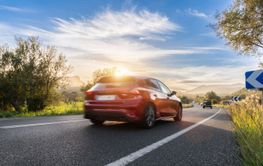 rental car in spain mountain landscape road at sunset