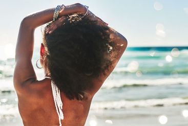 Back, stretching and view with woman on beach in summer...
