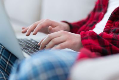 man freelancer in bathrobe working from home
