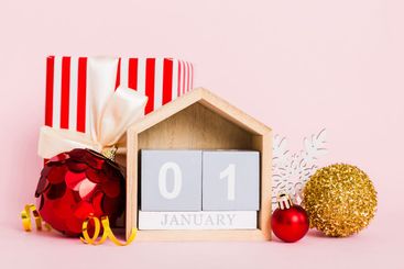 1 january. Christmas composition on colored background...