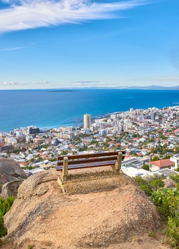 Bench, city and view of sea for travel, holiday and...